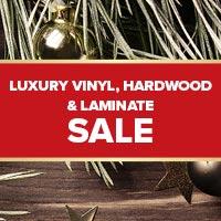 Luxury vinyl on sale now! Free furniture moving, removal of exising carpet, retacking of adjoining carpet and financing - all free!